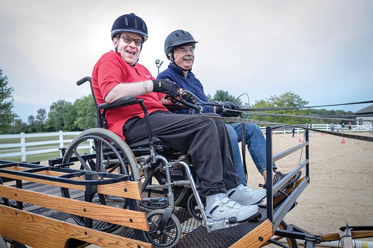 Adult students driving a carriage