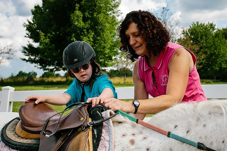 Instructor working with a young student