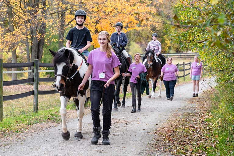 Students riding down a trail