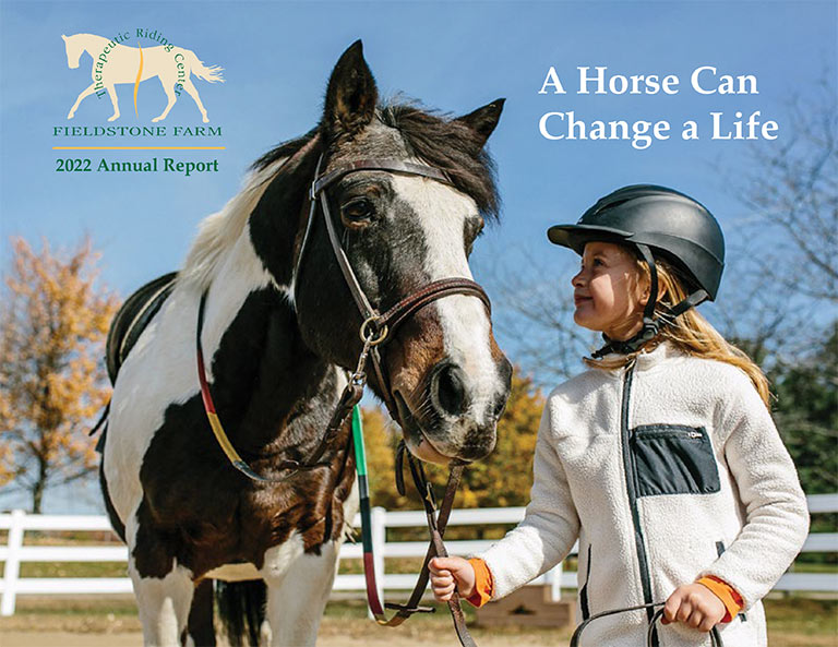 Fieldstone Farm 2022 Annual Report cover, a young rider standing next to a horse look at the side it it's face