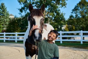 Braeden with Jackson the horse